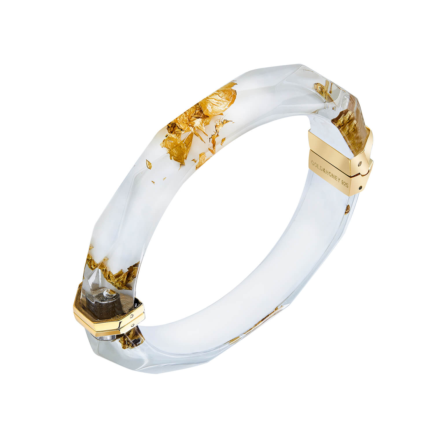 White bangle with gold accents on a white background