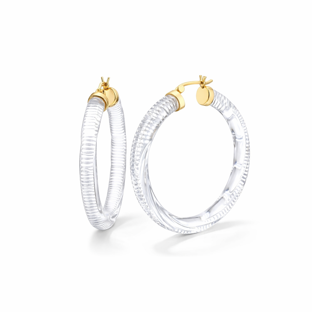 Pair of clear hoop earrings with gold accents on a white background