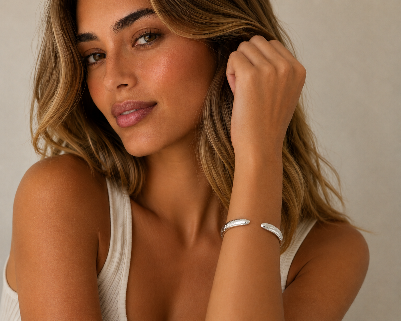 Model with Hammered cuff bangle with her arm upright