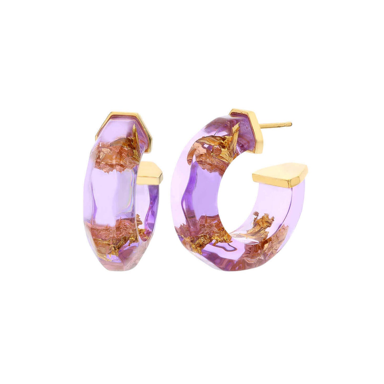 A pair of chunky gold hoop earrings filled with translucent lavender purple resin and embedded gold leaf elements, shown on a plain white background.