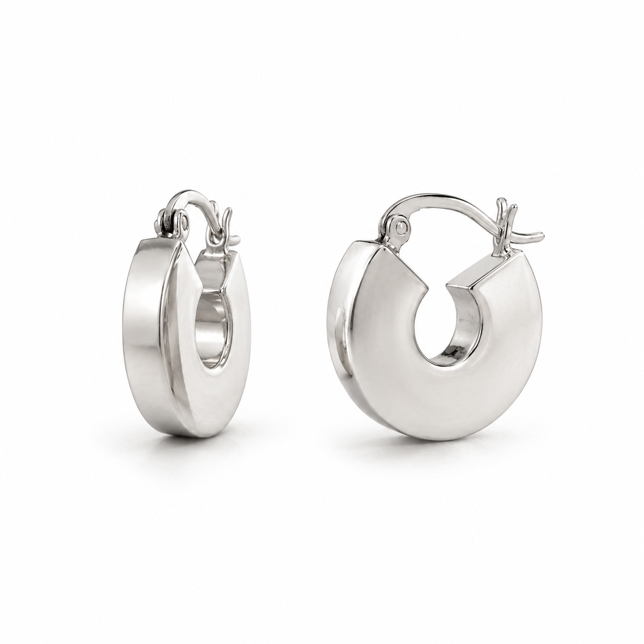 Pair of silver hoop earrings on a white background