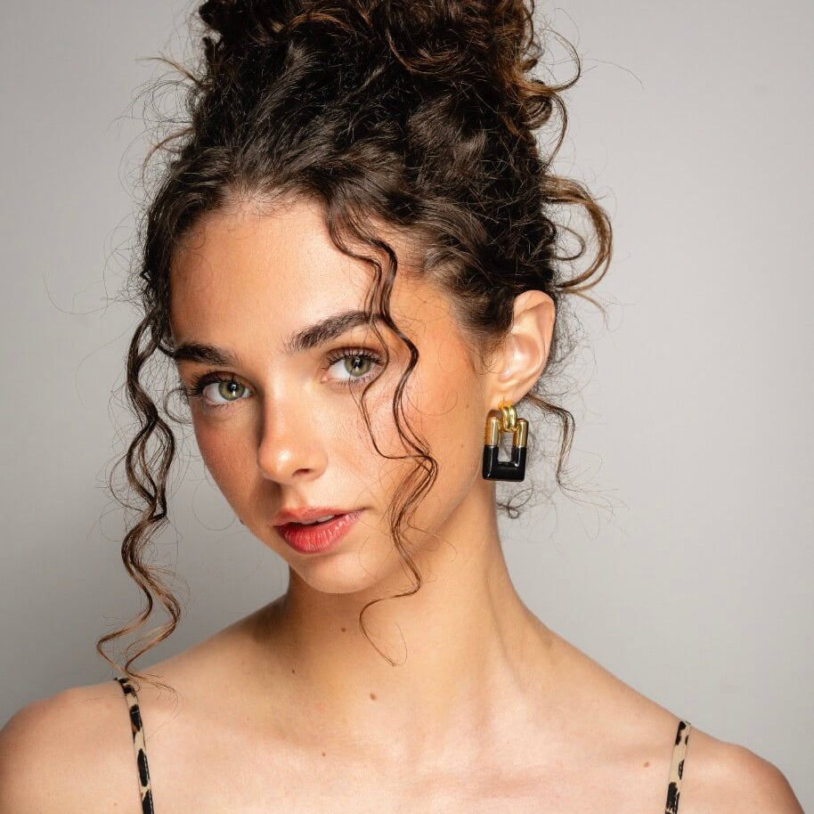 Door knocker earrings in gold and black