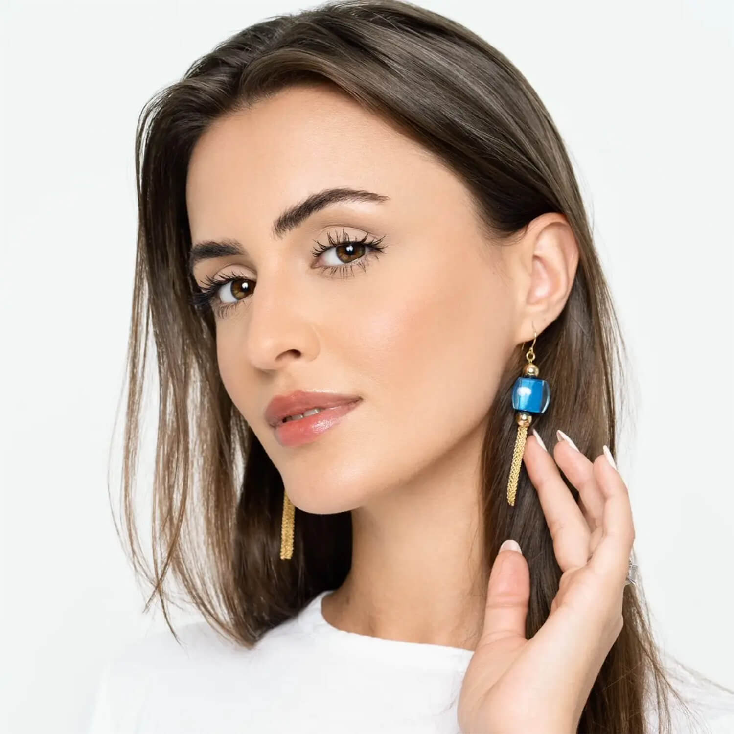 model wearing blue bead tassel earrings