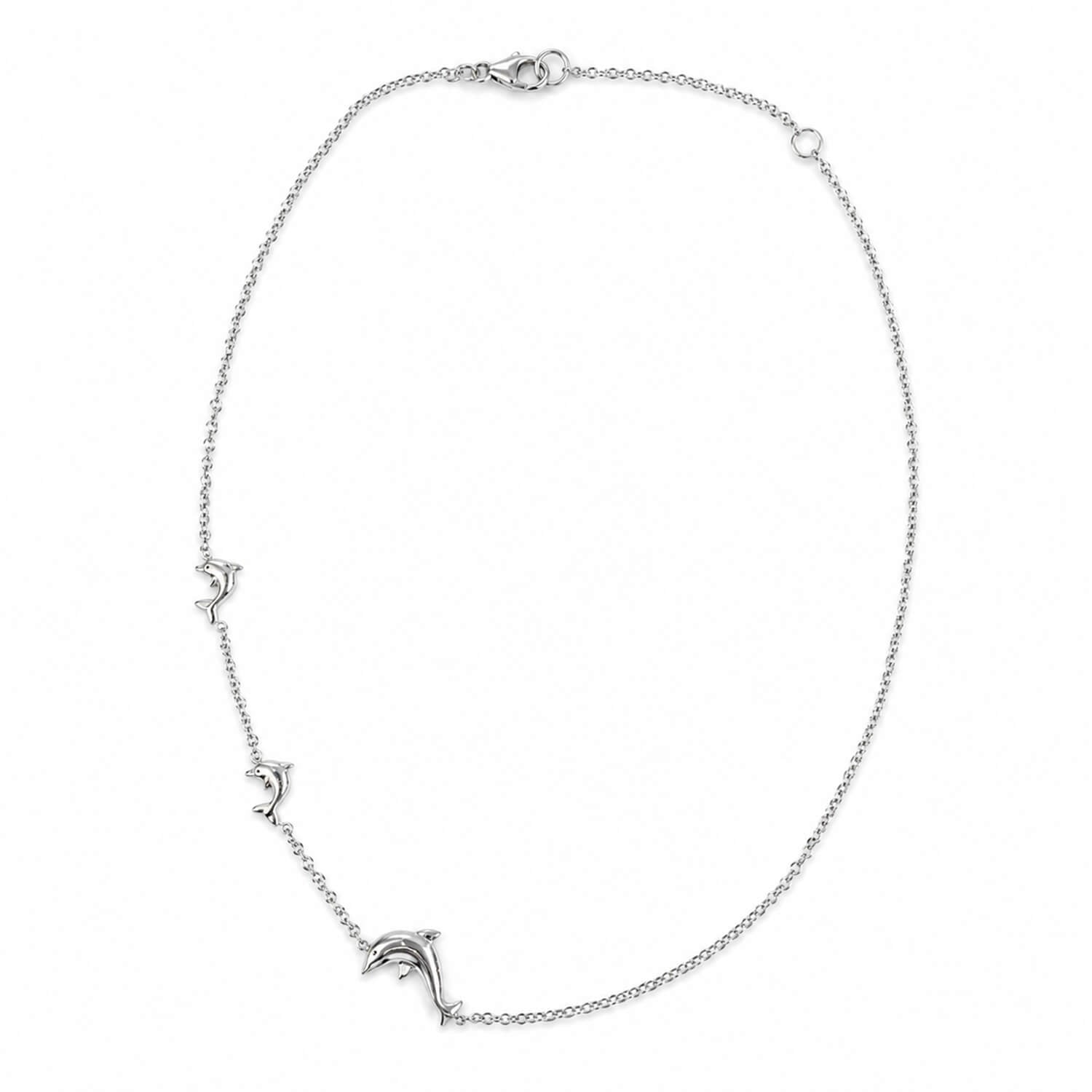Silver necklace with small dolphins on a white background