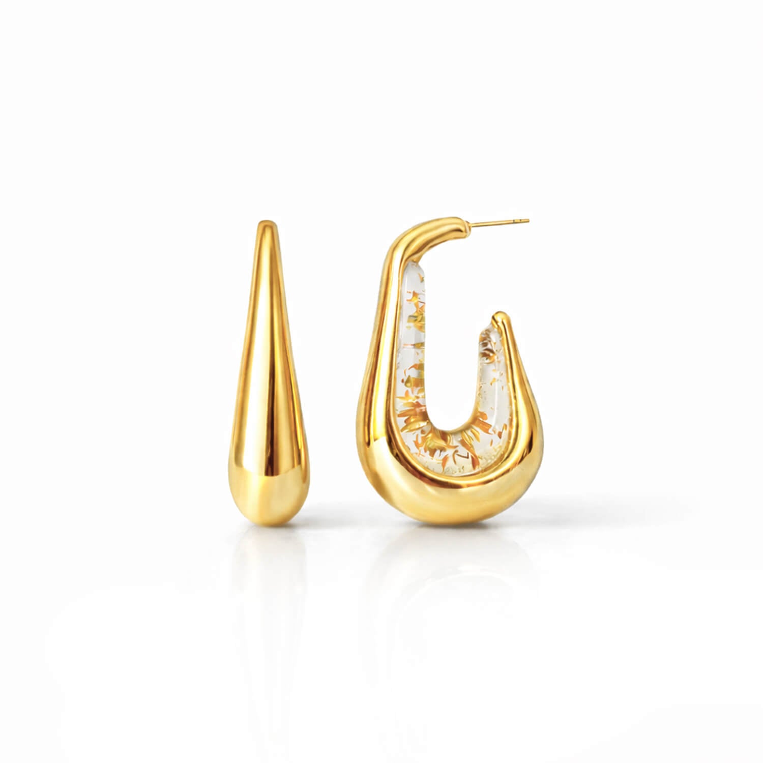 Gold hoop earrings on a white background