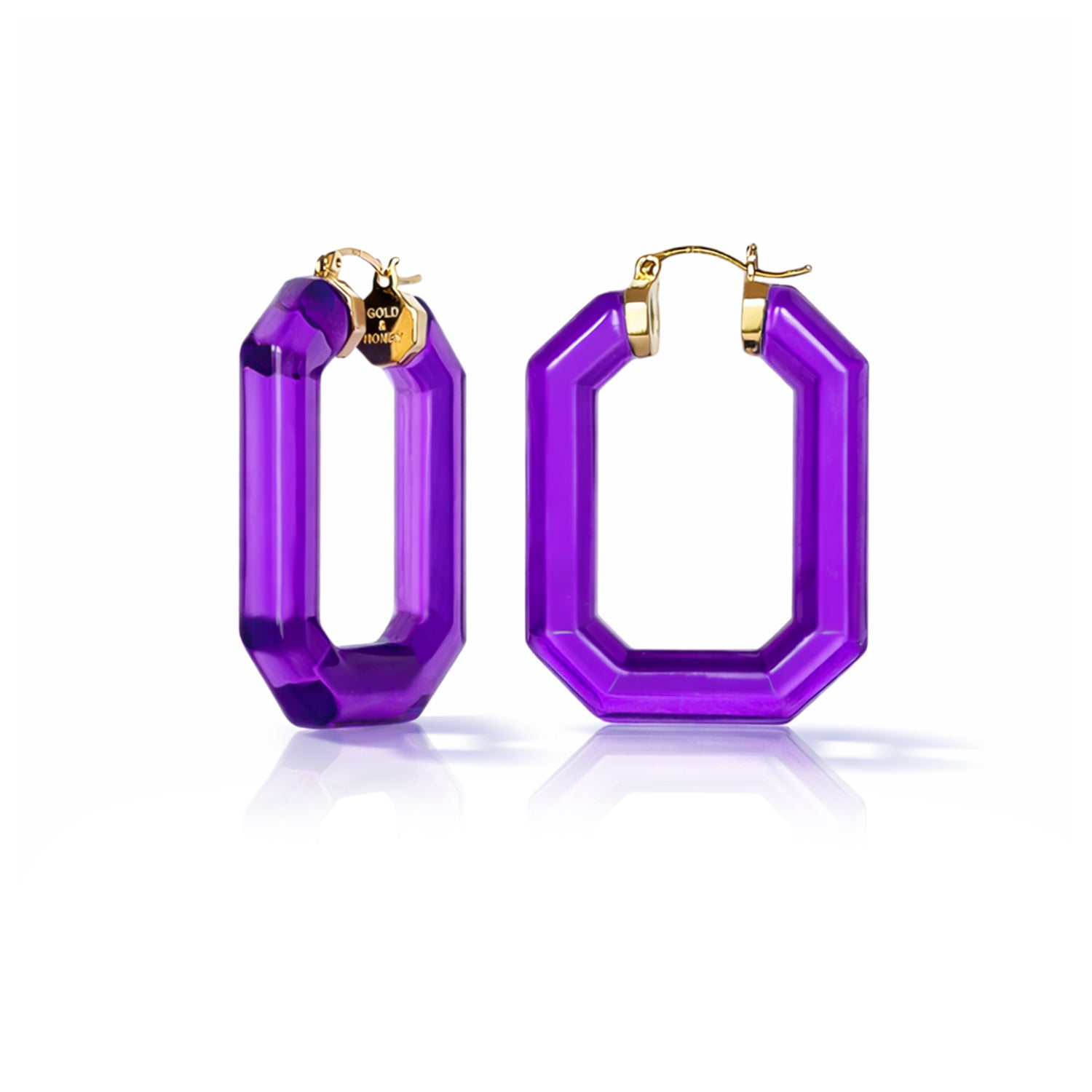 Purple hoop earrings with gold accents on a white background