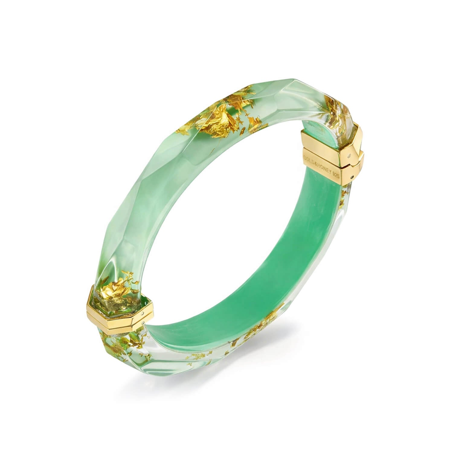 Green bracelet with gold accents on a white background
