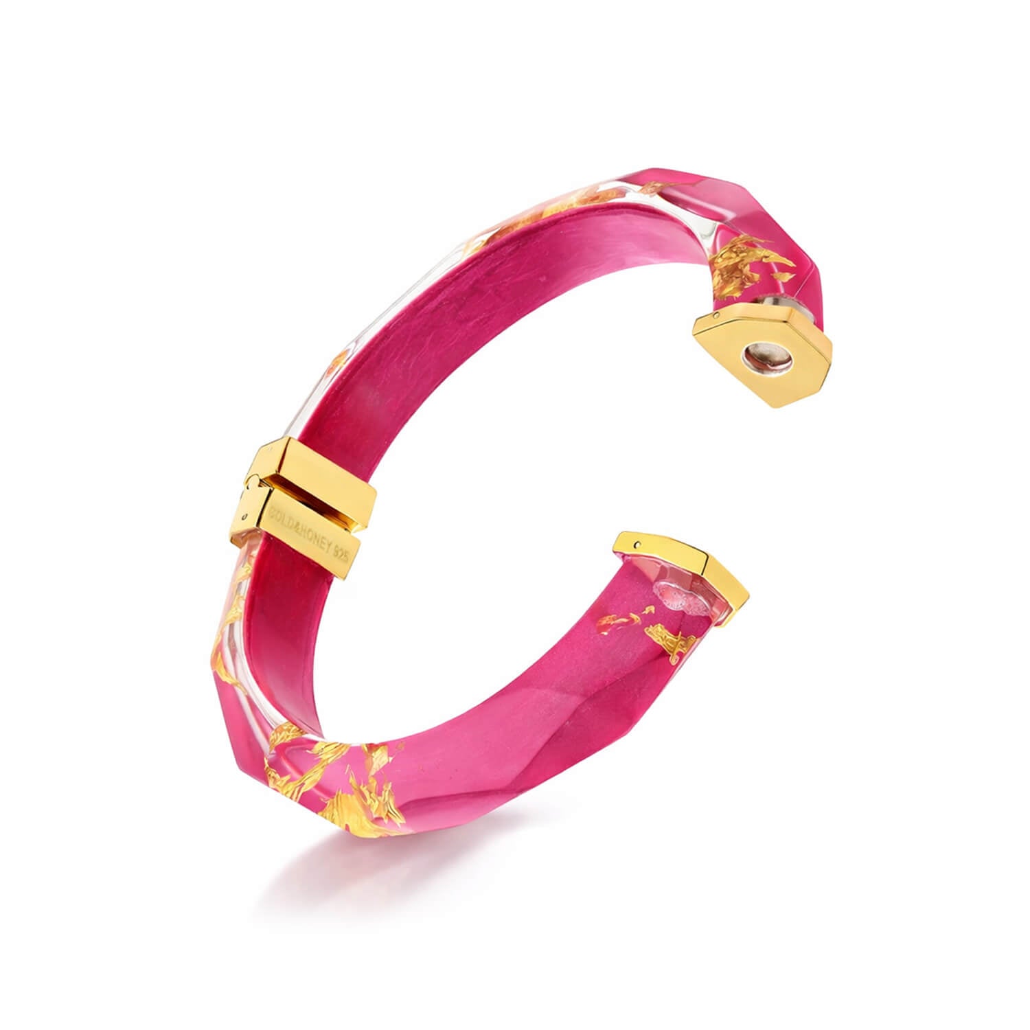 Pink bracelet with gold accents on a white background