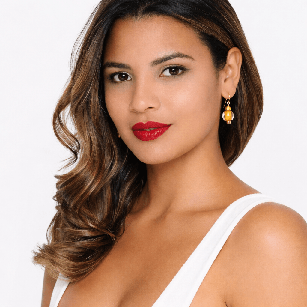 model wearing mini drop bead earrings