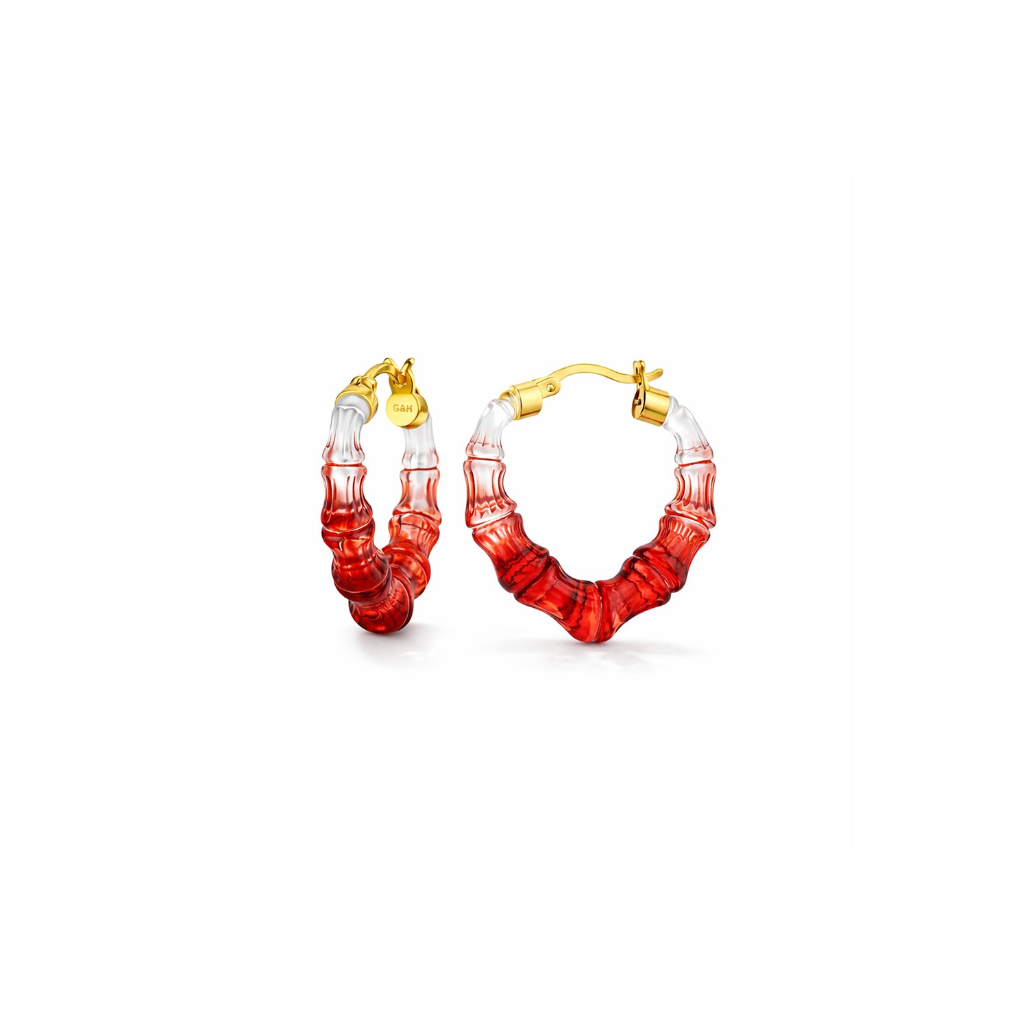Pair of red hoop earrings with gold accents on a white background
