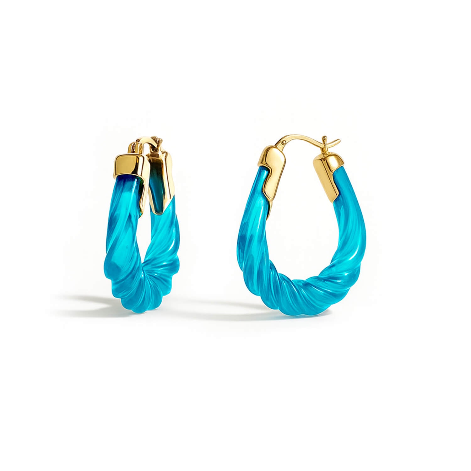 Turquoise hoop earrings with gold accents on a white background