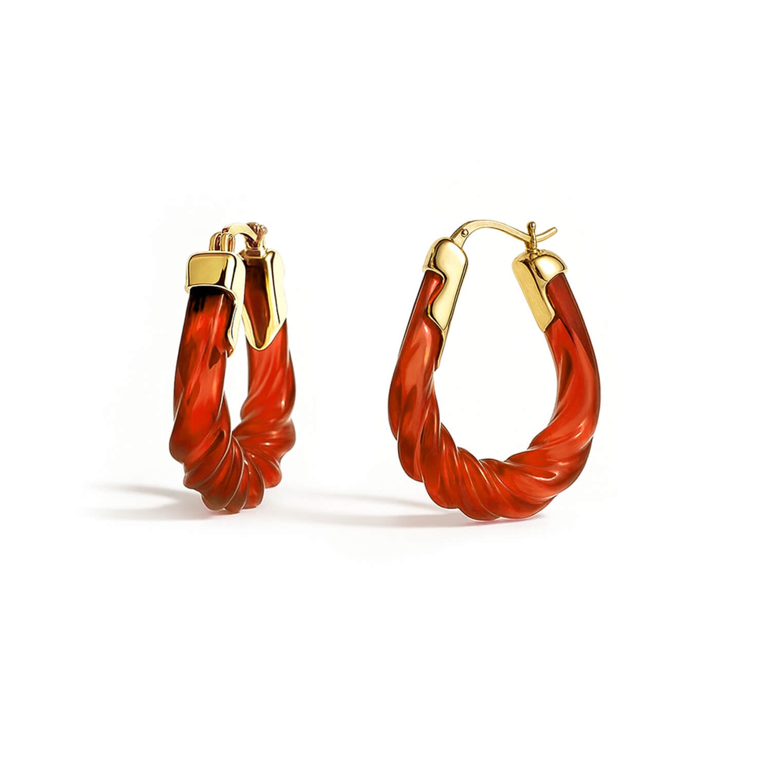 Pair of red hoop earrings with gold accents on a white background