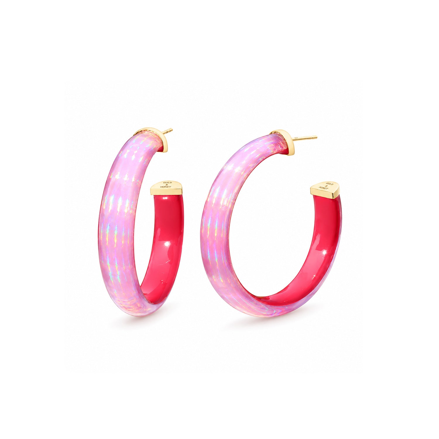 A pair of gold hoop earrings with a glossy pink and iridescent holographic finish, shown on a clean white background.