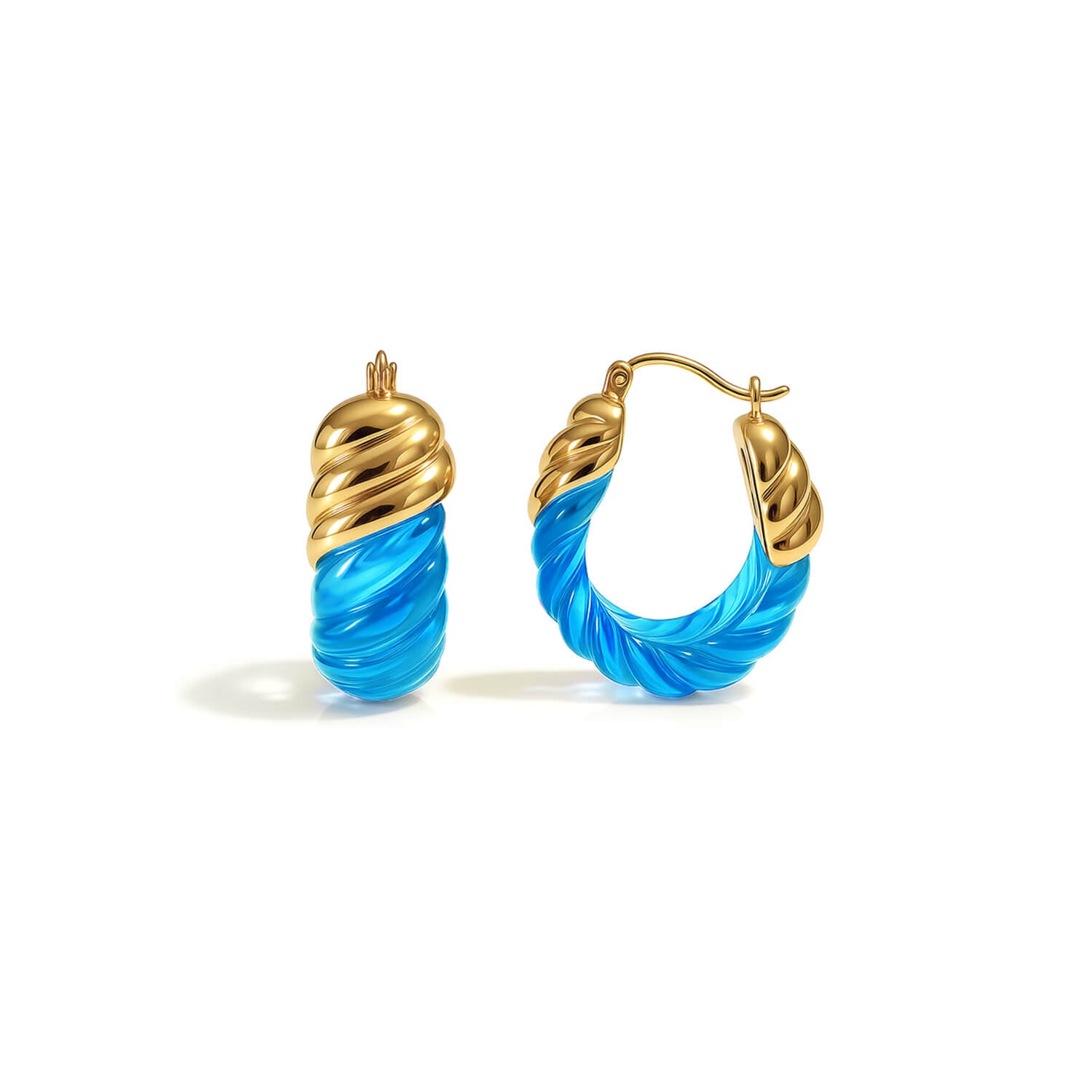 Gold and blue hoop earrings on a white background