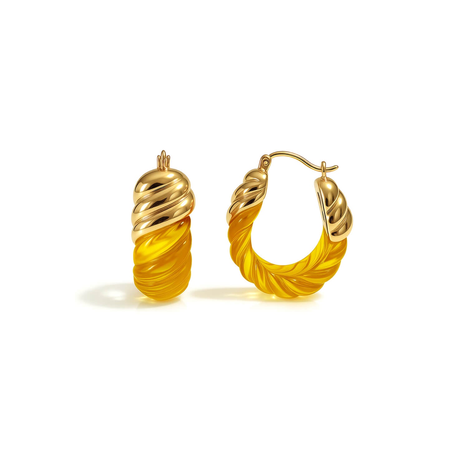 Pair of gold hoop earrings with yellow accents on a white background