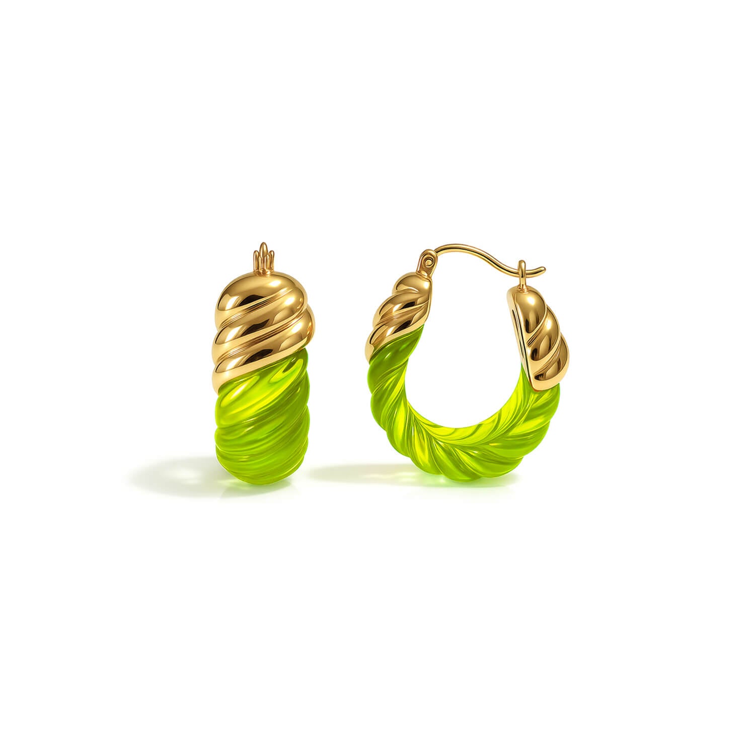 Gold and green hoop earrings on a white background