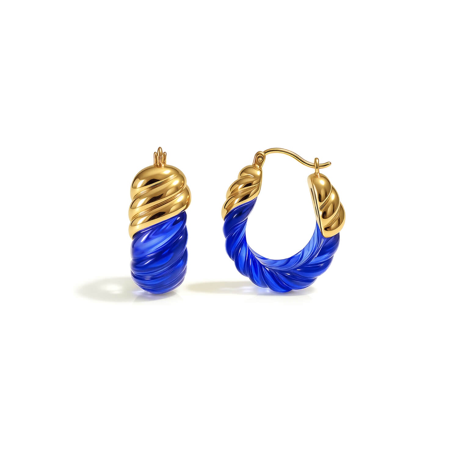 Gold and blue hoop earrings on a white background