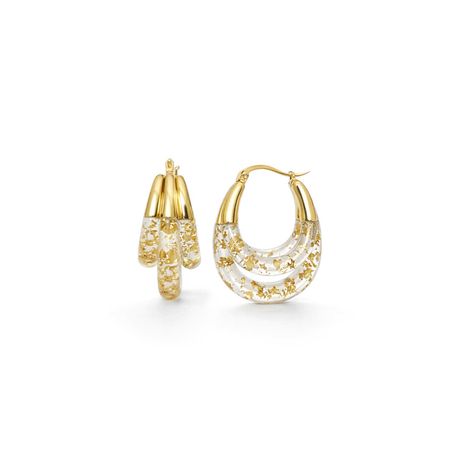 Gold hoop earrings with gold flakes on a white background