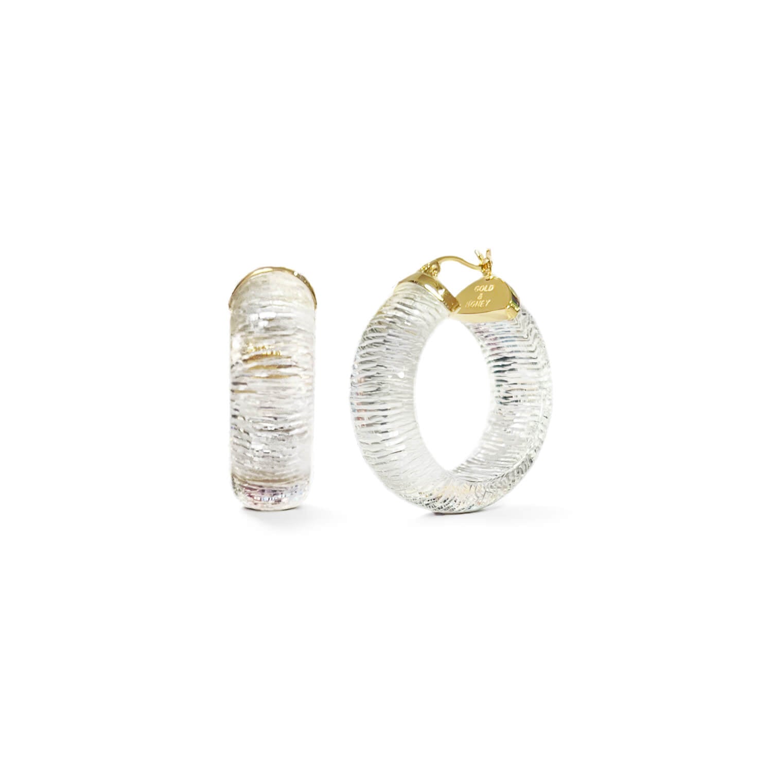 wide diamond cut hoop earrings in clear lucite