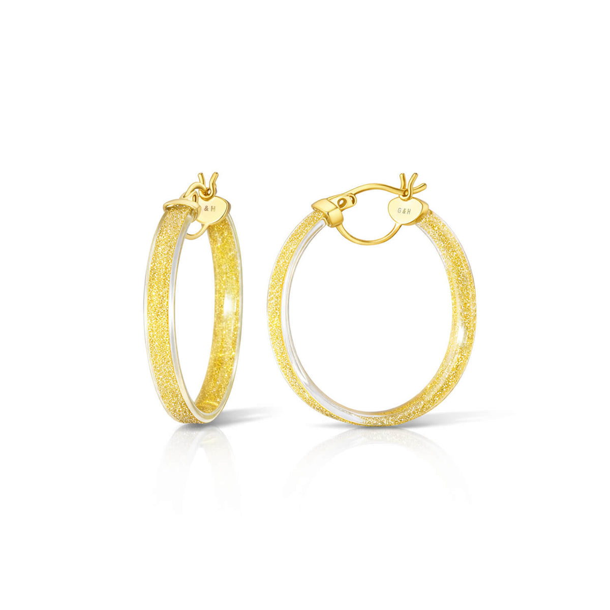 Gold hoop earrings on a white background