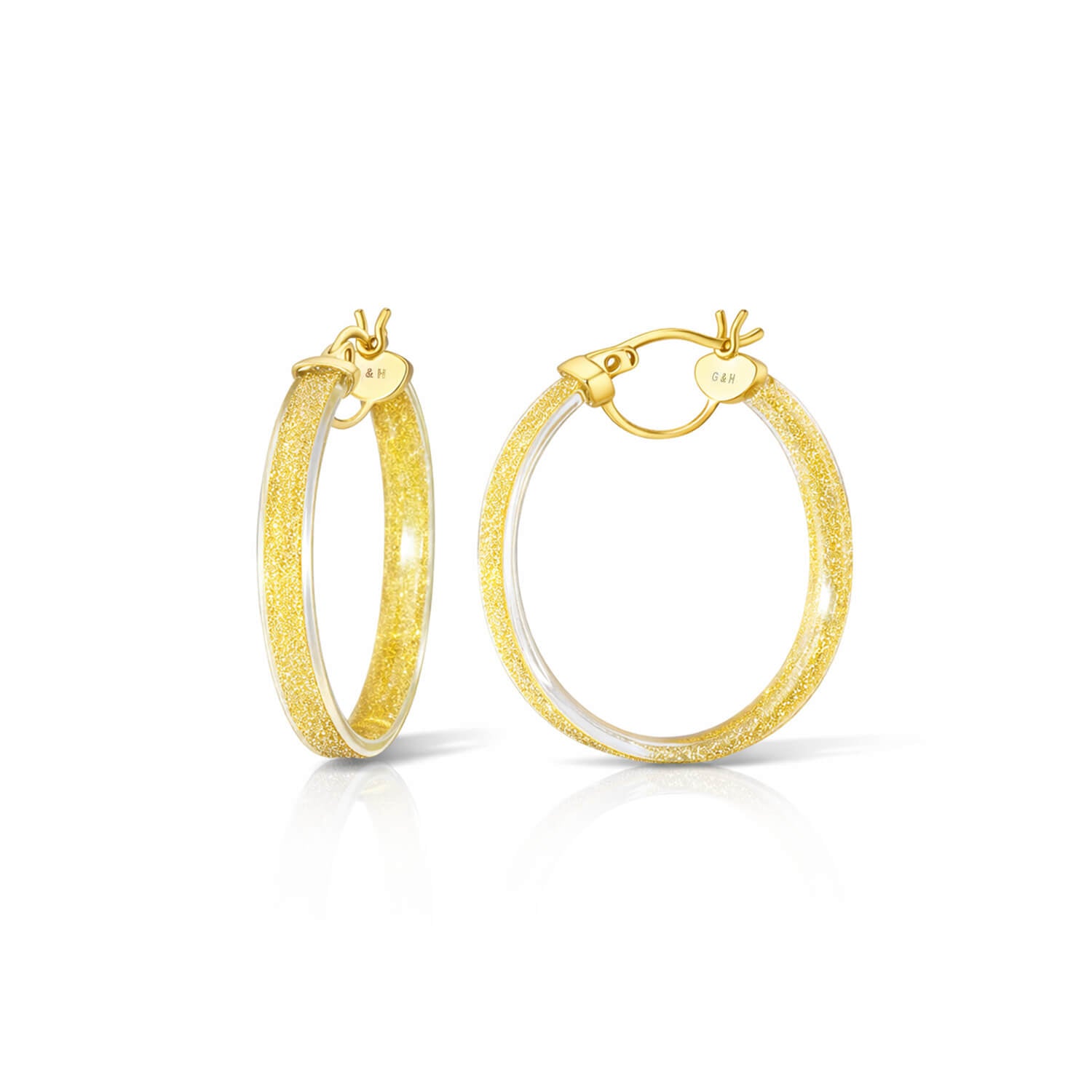 Gold hoop earrings on a white background