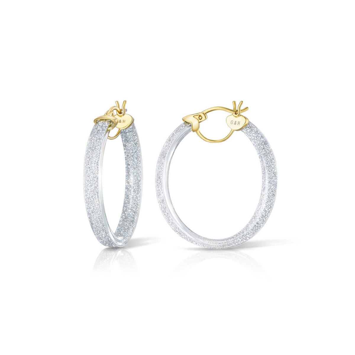 Pair of hoop earrings with gold clasps on a white background