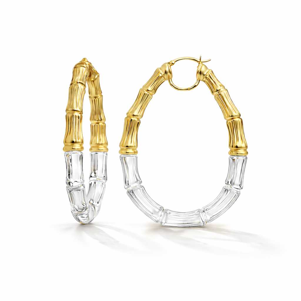 Gold and clear hoop earrings on a white background