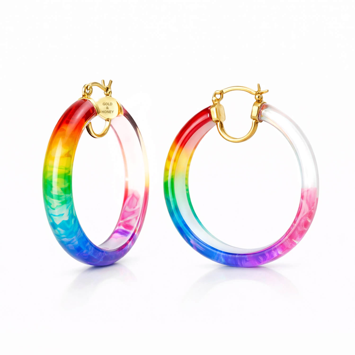 Rainbow hoop earrings with gold hooks on a white background