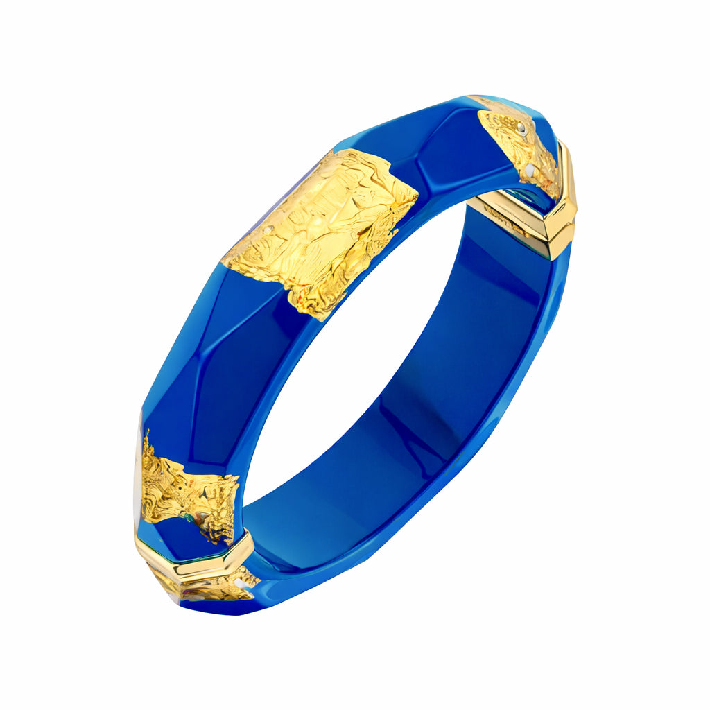 Blue bracelet with gold accents on a white background
