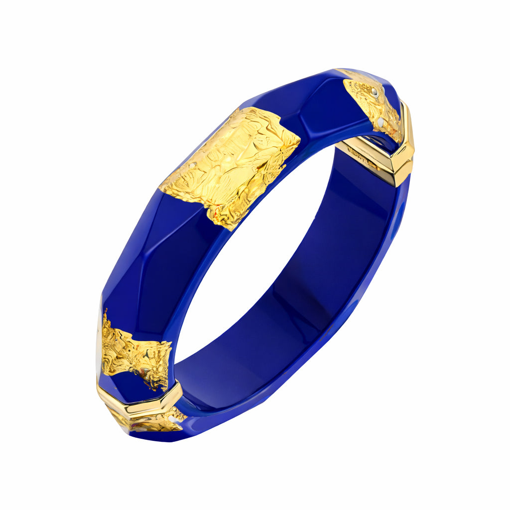Blue bracelet with gold accents on a white background
