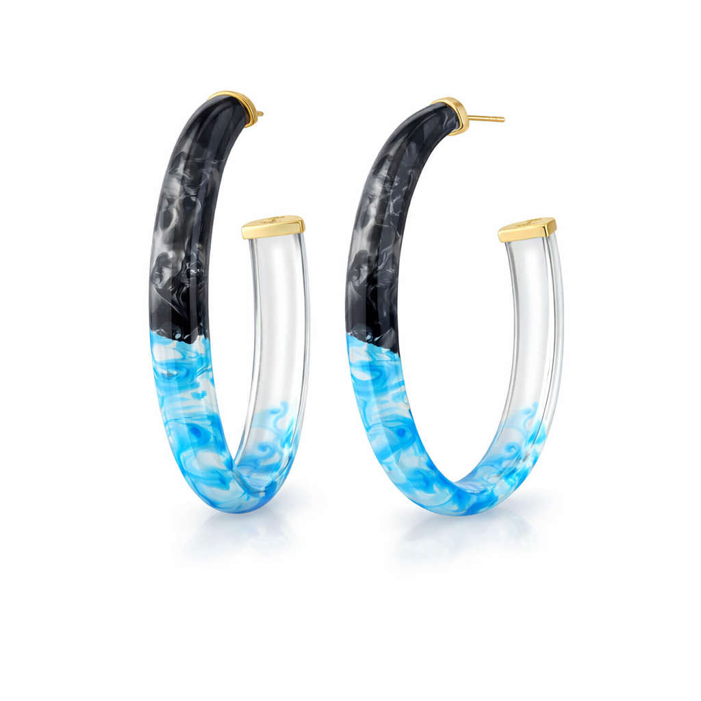 Hoop earrings with black, blue, and clear design on a white background