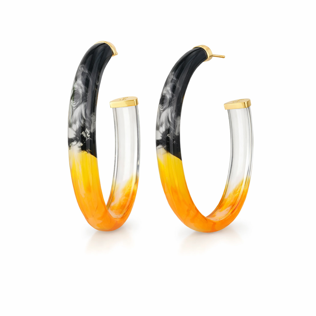 Hoop earrings with black, orange, and clear gradient design on a white background