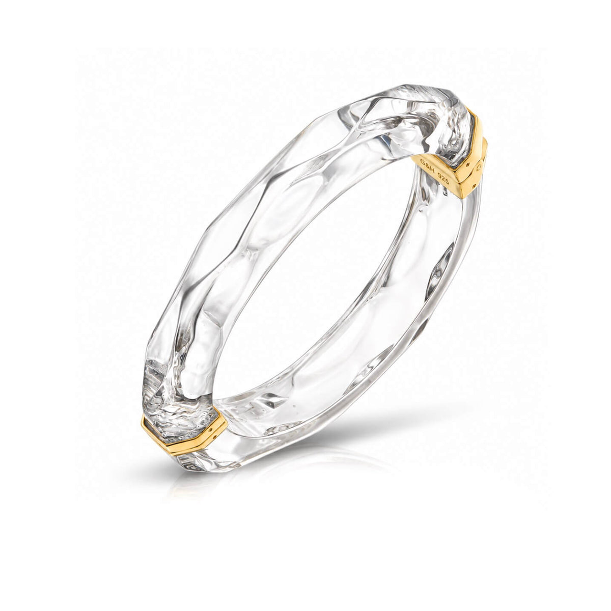 clear faceted bangle on white background