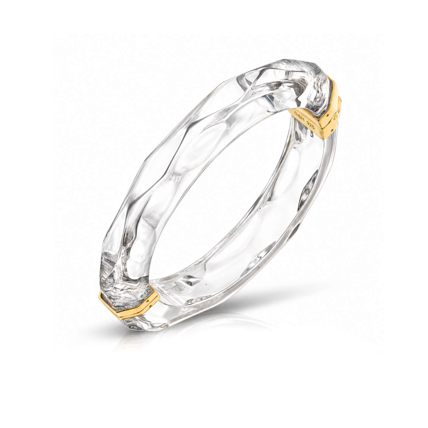 clear faceted bangle on white background