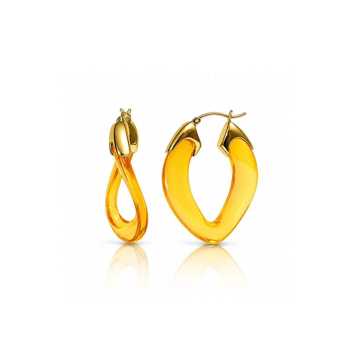 A pair of gold hoop earrings with a thick, curved amber-yellow translucent center, shown on a clean white background with a soft reflection below.