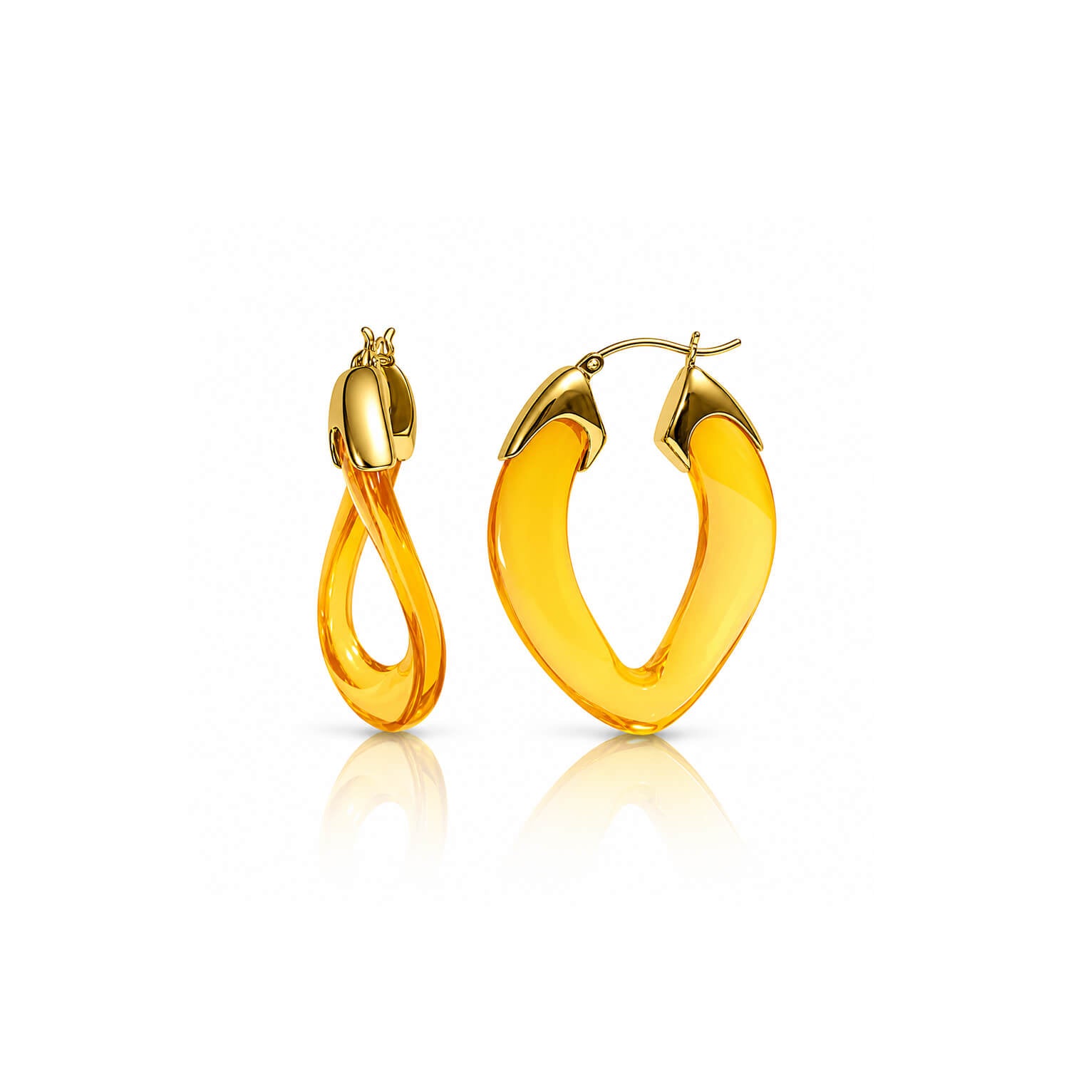 A pair of gold hoop earrings with a thick, curved amber-yellow translucent center, shown on a clean white background with a soft reflection below.