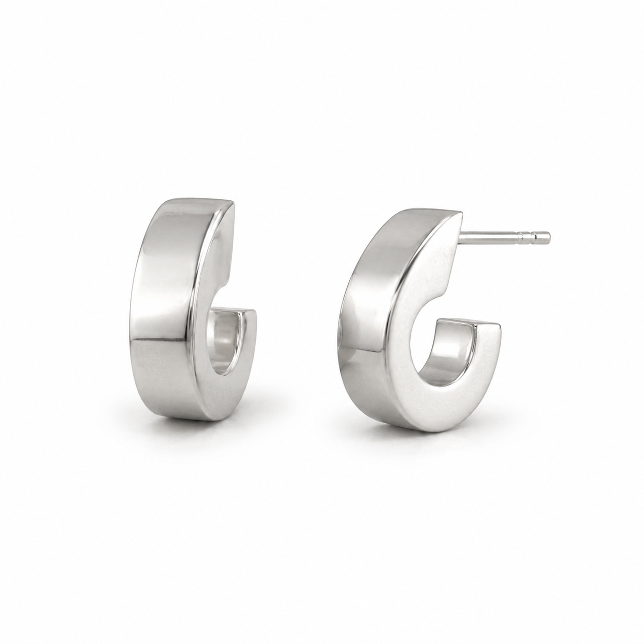 Pair of silver hoop earrings on a white background
