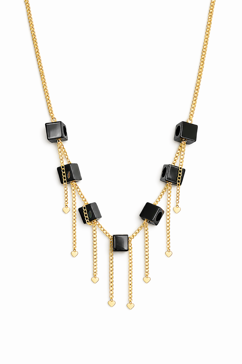 Gold necklace with black square beads on a white background