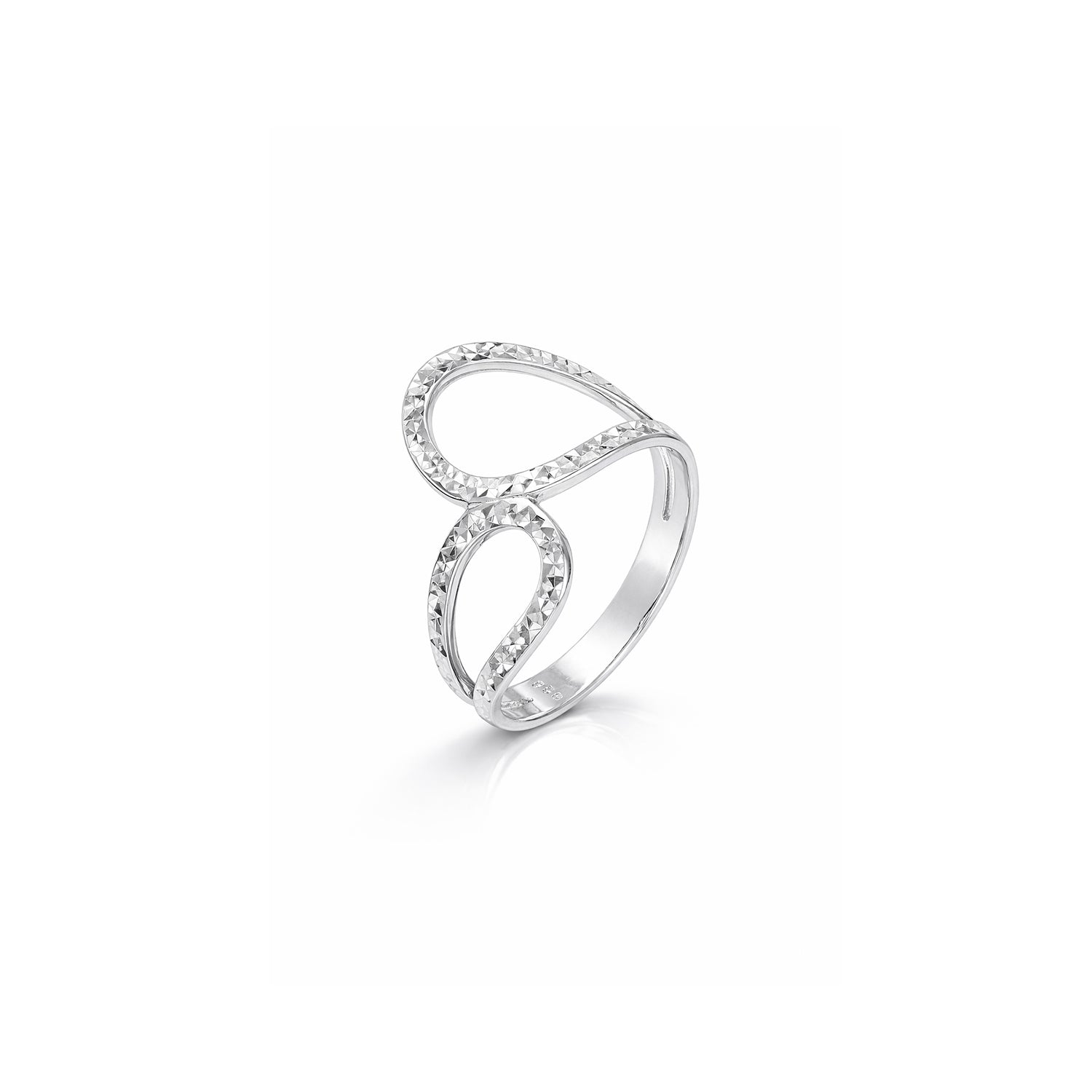 Silver ring with intricate design on a white background