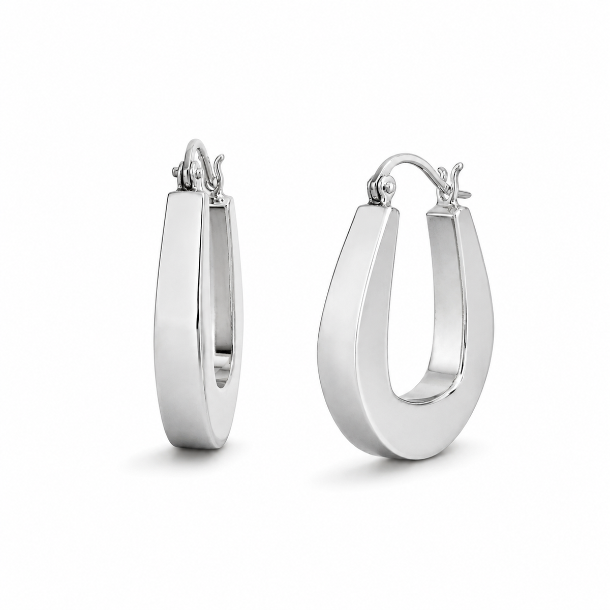 Pair of silver hoop earrings on a white background
