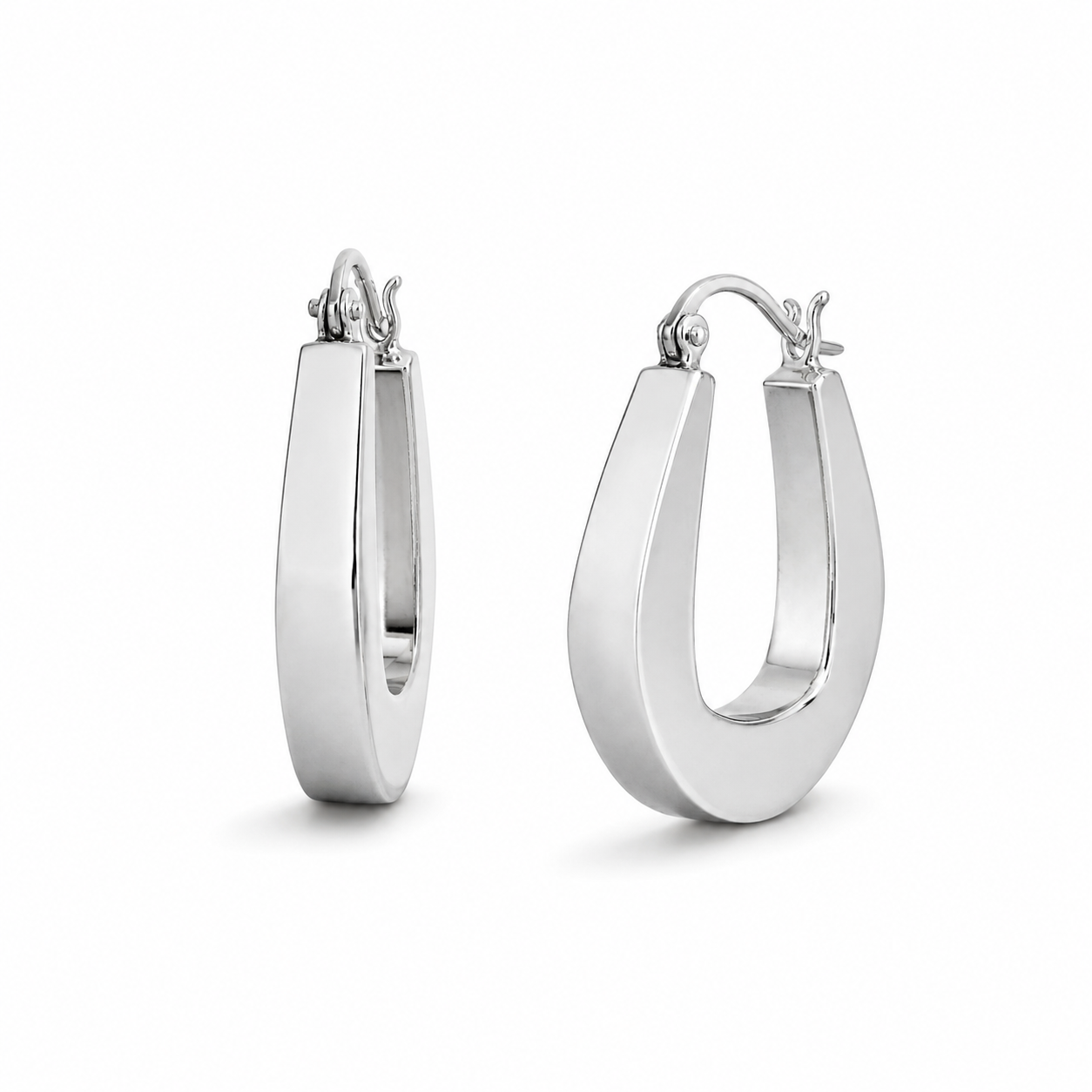 Pair of silver hoop earrings on a white background