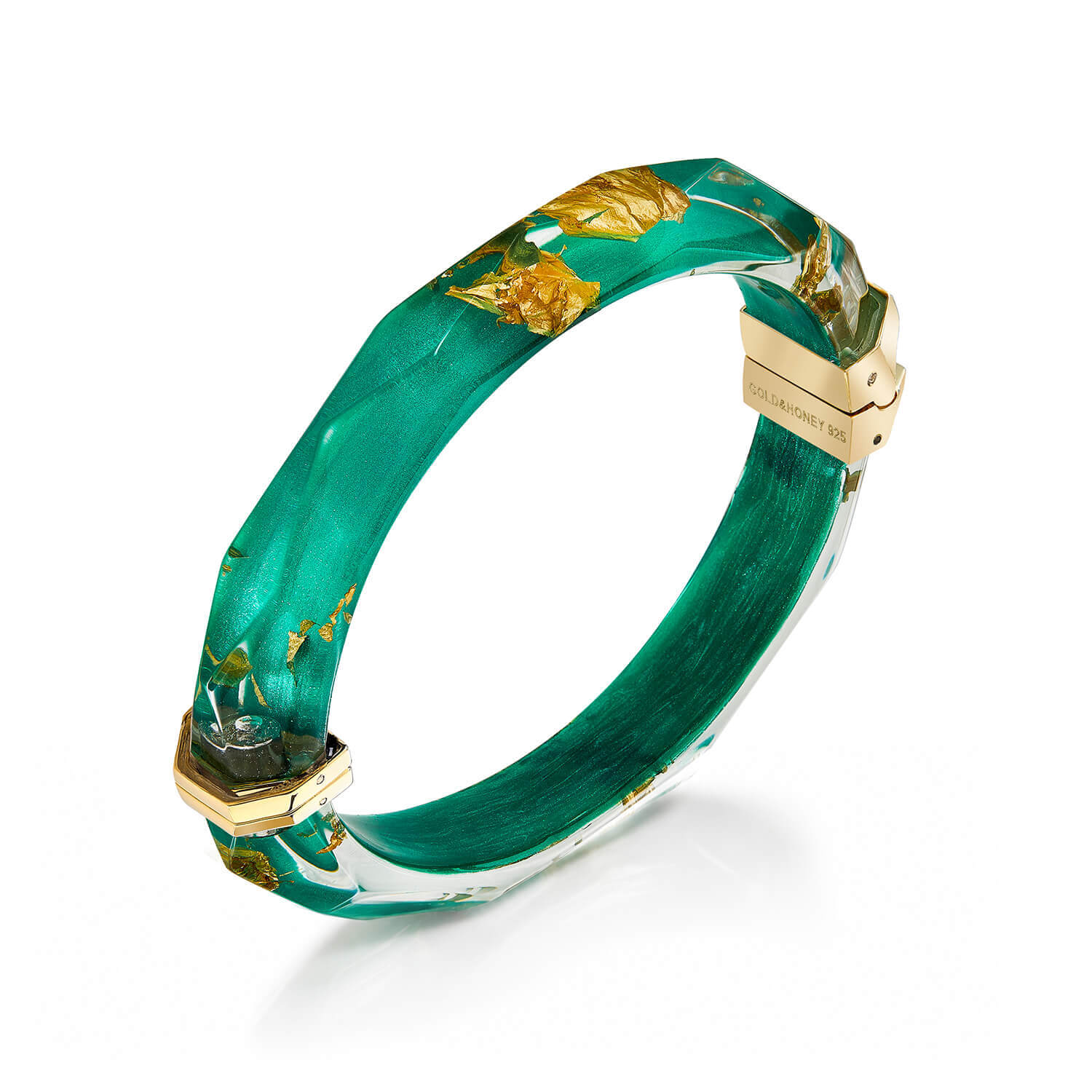 A green resin bangle bracelet with gold foil leaf inclusions and gold-toned metal hardware, shown on a clean white background.
