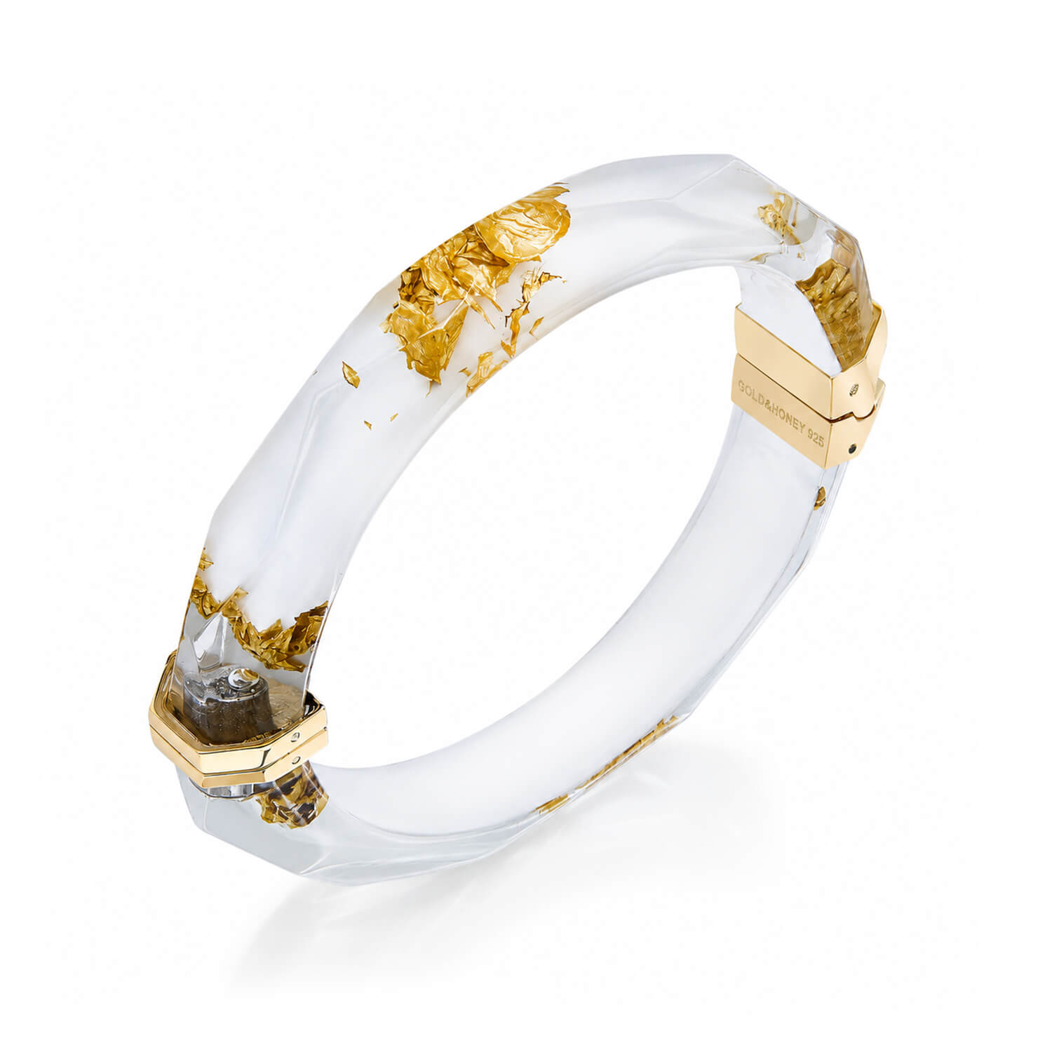 A white resin bangle bracelet with embedded gold leaf flakes and gold-toned metal hardware, shown on a clean white background.