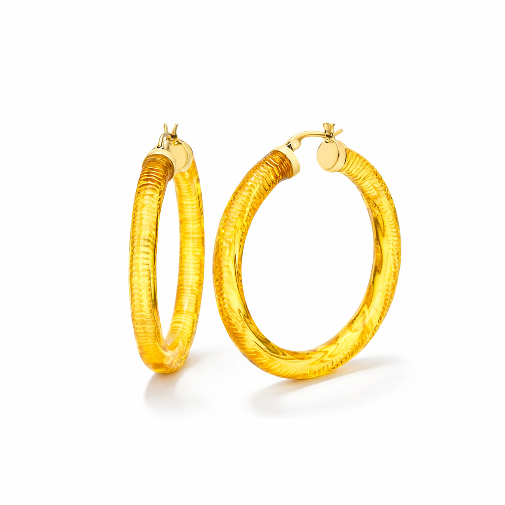 Pair of yellow gold hoop earrings on a white background
