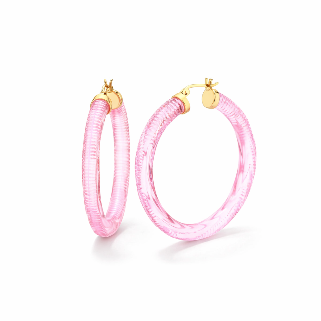 Pink hoop earrings with gold accents on a white background