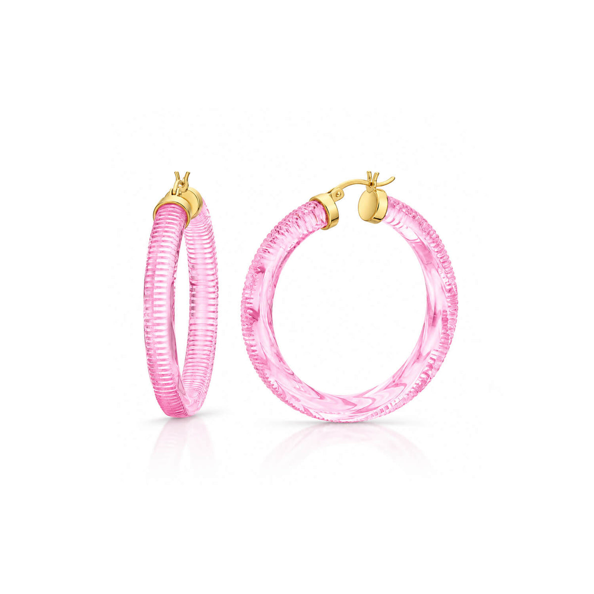 light pink hoop earrings with texture on a white background