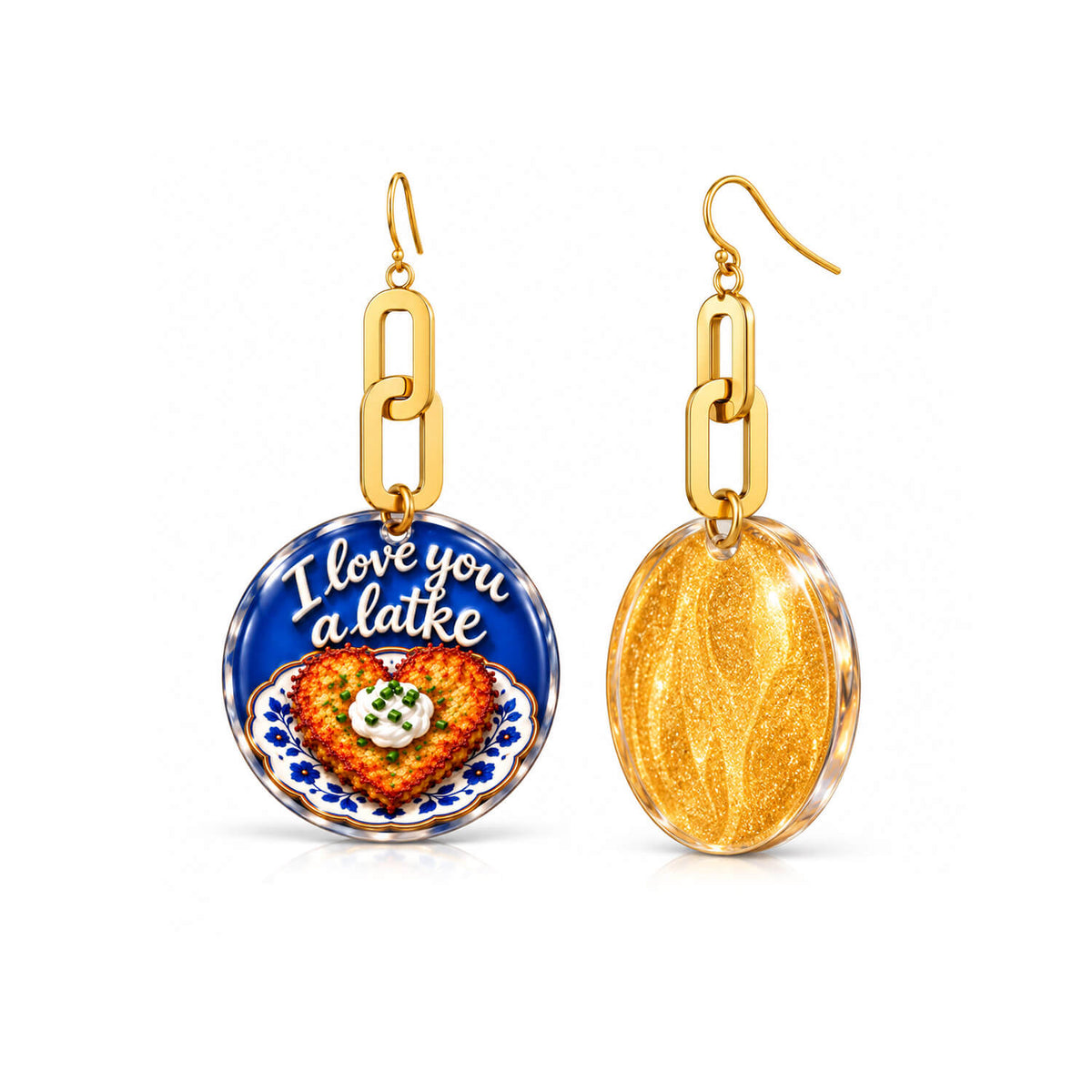 A pair of gold-tone dangle earrings on a white background. One round pendant shows a colorful food illustration with the text 'I love you a latte' on a blue background, and the other pendant is a textured gold oval.