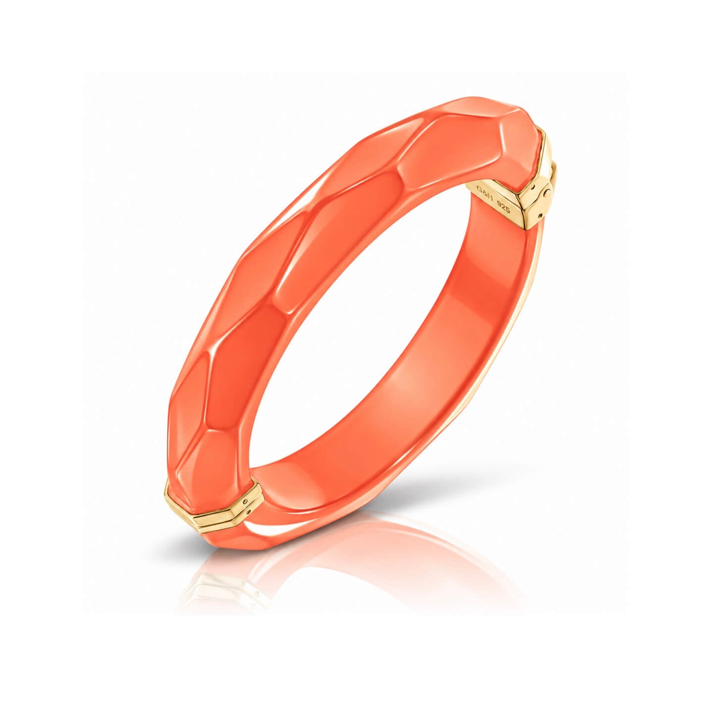 orange faceted bangle on white background