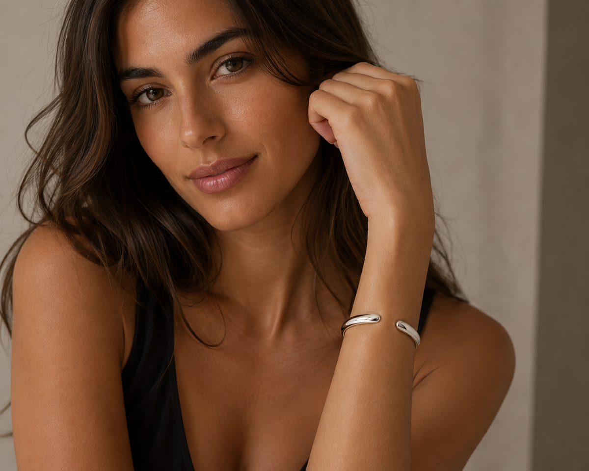 Model with high polish cuff bangle with brown hair