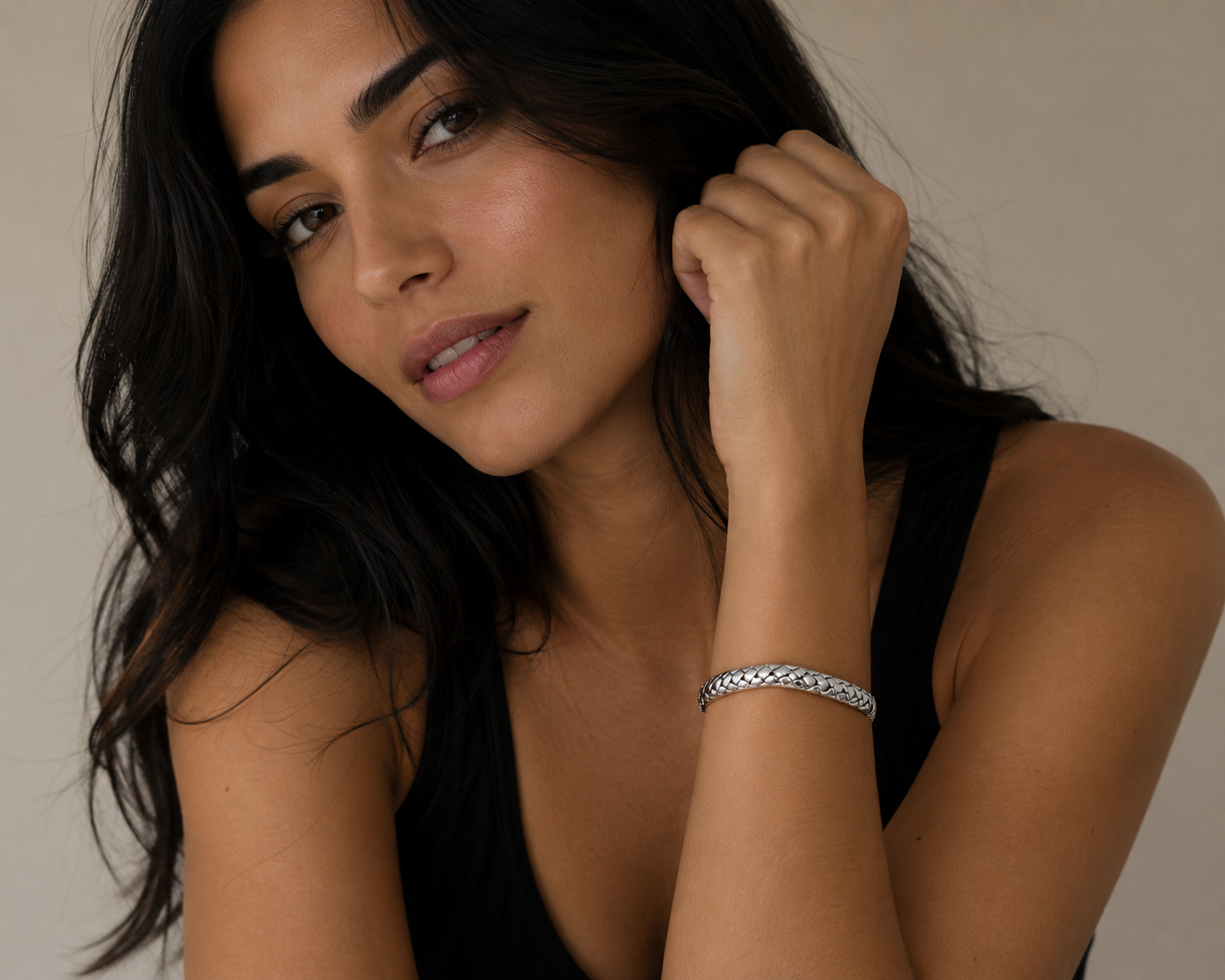 Woven bangle with hinge on a white background